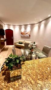 Flat Cosmopolitan PRAIA com Estacionamento Incluso - Gonzaga - Ap 76