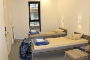 Twin Room with Private Bathroom room in De Ploate Hostel
