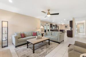 Surfside Beach House - Gorgeous Canal Front Home - Heated Pool & Boat Dock