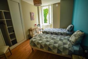 Auberges de jeunesse Amani Hostel : Chambre Lits Jumeaux