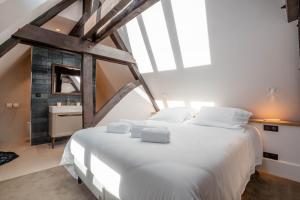 Cote Paradis - Appartements de Charme au centre-ville de Beaune : photos des chambres