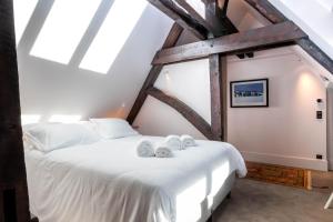 Cote Paradis - Appartements de Charme au centre-ville de Beaune : photos des chambres