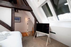 Cote Paradis - Appartements de Charme au centre-ville de Beaune : photos des chambres