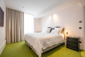 Cote Paradis - Appartements de Charme au centre-ville de Beaune : photos des chambres