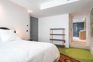 Cote Paradis - Appartements de Charme au centre-ville de Beaune : photos des chambres