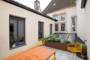 Cote Paradis - Appartements de Charme au centre-ville de Beaune : photos des chambres