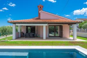 Olive tree oasis with heated pool