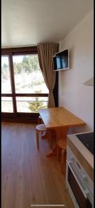 Appartements Studio pour 4 personnes pied dans les pistes : photos des chambres