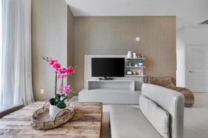 Wake Up to the Sound of Waves in a Stylish Condo in a Luxury Resort