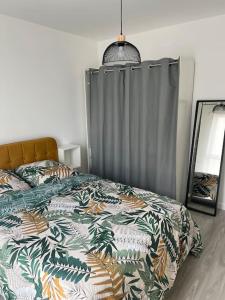 Appartements Appartement F3 cozy avec balcon proche de Paris et aeroport CDG : photos des chambres
