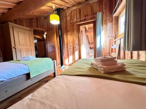 Maisons de vacances C Les rondins nature gite 8 personnes avec jardin : photos des chambres