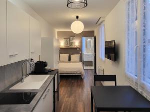 Appartements Appartement 2 Coin cuisine, coin chambre, salle de bain : photos des chambres