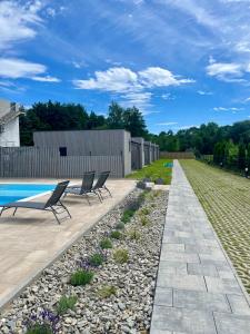 A Morze Domki- Podgrzewany basen, całoroczne klimatyzowane domki, parking