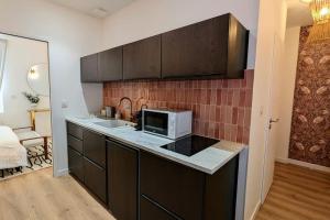 Appartements Suite Meraki - Luxe & Voyage - Jacuzzi & Cinema : photos des chambres