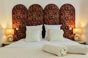 Appartements Suite Meraki - Luxe & Voyage - Jacuzzi & Cinema : photos des chambres