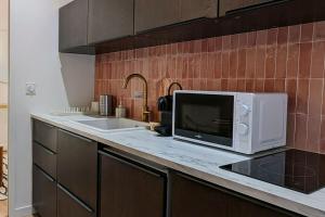 Appartements Suite Meraki - Luxe & Voyage - Jacuzzi & Cinema : photos des chambres