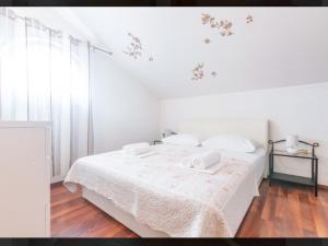  Two-Bedroom Apartment with Balcony - Attic room in Banić Apartments with pool