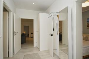 Ferienwohnung mit eigener Sauna und Terrasse- Haus Inselwind FeWo MEERfamilie