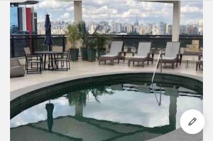 Flat particular com cozinha completa! Serviços de Hotel.