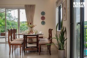 StayVista at Amber & Mist - Pool and Lawn