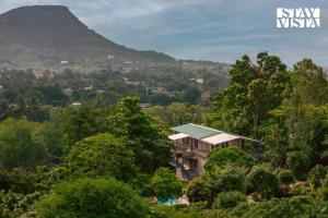 StayVista at Amber & Mist - Pool and Lawn