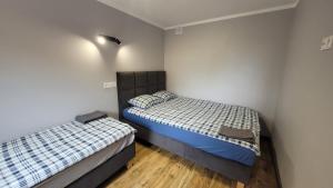 Wrzosowe Wzgórze 5 - Studia i Apartamenty