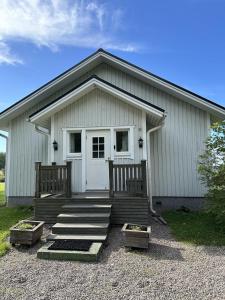 House and guest house with sauna by the sea