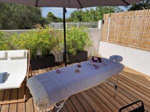 Appartements Au Douni - Jacuzzi, jardin, parking couvert et bureau equipe : photos des chambres