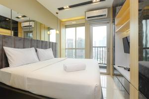 Great Location Studio at The Newton Ciputra World 2 Apartment By Travelio