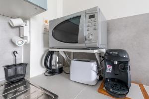 Appartements Le Ptit Henri - Studio a 20min de Paris : photos des chambres