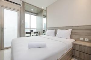 Stunning Studio at Ciputra World 2 Apartment By Travelio