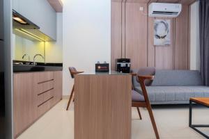 Elegant and Comfort 1BR at Ciputra World 2 Apartment By Travelio