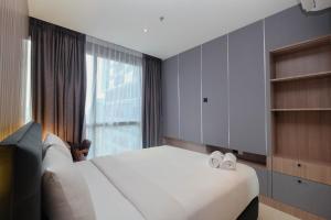 Elegant and Comfort 1BR at Ciputra World 2 Apartment By Travelio