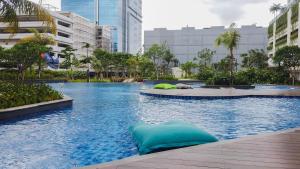 Nice and Elegant 1BR at The Kensington Royal Suites Apartment By Travelio