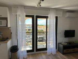 Studio cabine en étage, front de mer