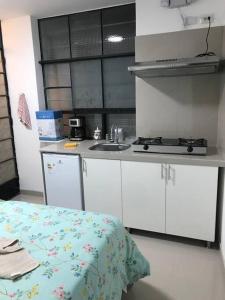 Albano Habitación con cocina y baño