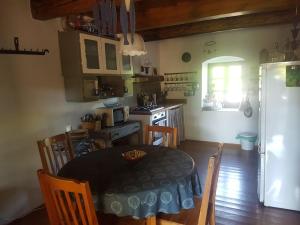 Nádtetős ház Gyenesdiáson a vízpart közelében