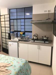 Albano Habitación con cocina y baño