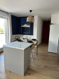 Appartements Le Contrie - Bel appartement avec terrasse : photos des chambres