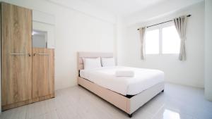 Best Choice and Homey 2BR at Puncak Dharmahusada Apartment By Travelio