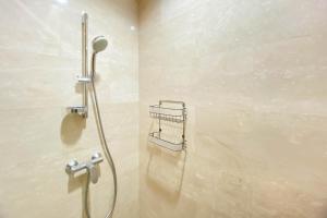 Spacious and Combined 2BR at Menteng Park Apartment By Travelio