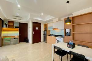 Spacious and Combined 2BR at Menteng Park Apartment By Travelio