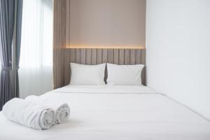 Comfort and Modern Look 2BR at 26th Floor Samara Suites Apartment By Travelio