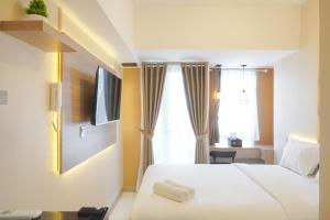 Cozy Studio Room at Tokyo Riverside PIK 2 Apartment By Travelio