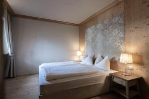 Junior Suite with Balcony room in Post Alpina - Family Mountain Chalets