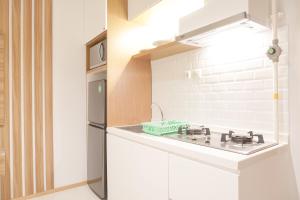 Nice and Comfort 1BR at 25th Floor Samara Suites Apartment By Travelio