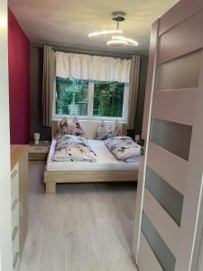 Byteček v rodinném domečku se sdíleným vchodem