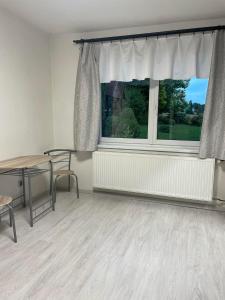 Byteček v rodinném domečku se sdíleným vchodem