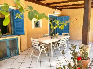 Blue shutters by the beach img56