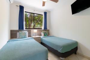 Two Palms Ground Floor Unit Across from Beach